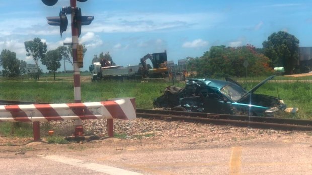 A woman was in critical condition after a car and train crash in Queensland.