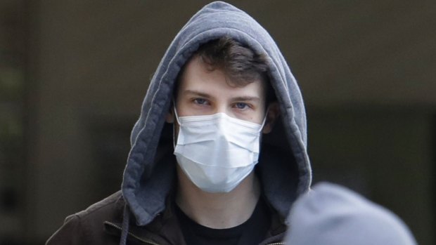 A man wearing a mask near Seattle, where several cases of COVID-19 have been confirmed. The mask has become a powerful symbol of a troubled world.