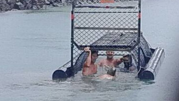 The men who were photographed in a crocodile trap near Port Douglas have been widely criticised.