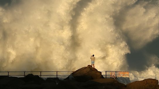 Large wave hits a rock pool at Curl Curl beach in Sydney. 