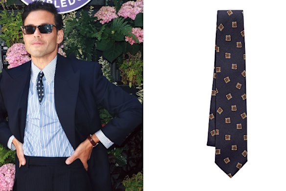 Left: actor Rami Malek. Right: Christian Kimber “Navy Blue and Brown Flower Stamp” silk tie.