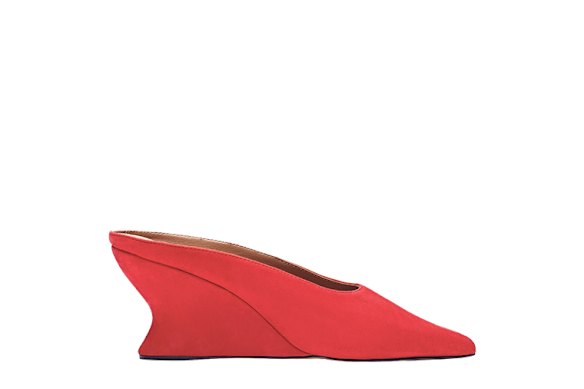 Sleek leather mules with a pointed toe and suede finish.