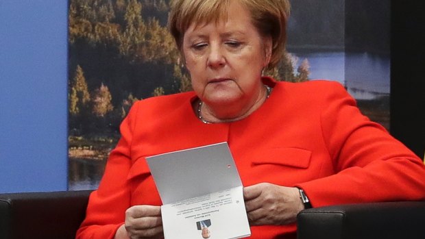 German Chancellor Angela Merkel checks her notes during a bilateral meeting with Prime Minister Scott Morrison at the G20 summit in Buenos Aires in Argentina on Saturday.