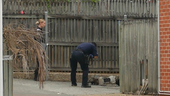 Police take photos of an electric scooter at the scene in Water Street.