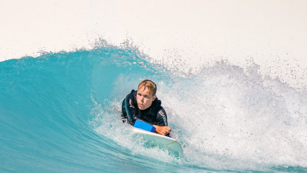 Vernon catching a wave at URBNSURF in Melbourne.