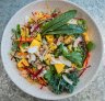 Mango salad bowl with papaya and peanuts.
