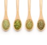 Wooden Spoon filled with herbs on white background Dried herbs for goodfood.com.au March 2020Â  wires storyÂ 