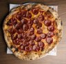 The 15-inch OG Roni pizza laden with pepperoni, fior di latte, pomodoro and fresh basil. 