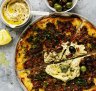 Lahmacun with hummus and olives.