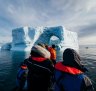 Our revelry is interrupted as a large ice sheet calves off a nearby glacier and crashes into the sea.