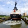 A tanker passing through Miraflores lock, guided by electronic "mules".