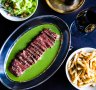 Sirloin steak frites with special sauce at Bouillon l'Entrecote in Sydney.