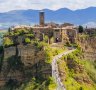 Civita di Bagnoregio. Founded by the Etruscans more than 2500 years ago, the remnants of this medieval town perch precariously on an eroding outcrop of volcanic rock in the Tiber River Valley. 