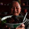 Peranakan Place owner Sam Wong with his dish ayam bush keluak (chicken braised with keluak nuts).