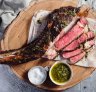 Beef tomahawk steak with chimichurri.