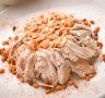 Chicken and rice topped with toasted almonds.