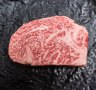 Japanese A5 wagyu beef, heavily marbled with fat.