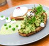 Avocado smooshed with peas and lime on sourdough.