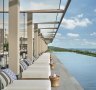 The resort's restaurant terraces tumble down first to the main pool lined with floating chairs, then further still to tranquil Long Beach.