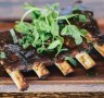 Half rack of slow-cooked pork ribs.