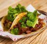 Beef birria tacos with Oaxaca cheese and salsa verde.