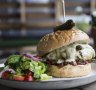 The hefty cheeseburger with Swiss cheese and relish at X and Co.