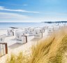 View from the top of the dunes at Bunker Hill, overlooking Rantum Beach's hooded beach chairs.