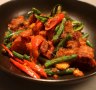 Must-try: Wok-fried pork belly with red curry paste, beans and kaffir lime leaf.