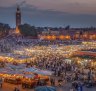 Everyone is out and about in Marrakech's Djemma El Fna Square by night.