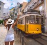 The popular Tram 28 that winds its way along the hilly streets of Alfama and Graça is packed like a Portuguese sardines can, though there's plenty of breeze blowing through the open windows.