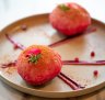 Raj khachori has been reinterpreted as pink semolina domes filled with chickpeas, yoghurt, pomegranate, tamarind and mint chutney.