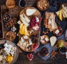 Displaying cheese in slices with fruits and nuts is equally pretty and practical for grazing guests.