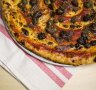 The pizza marinara is the go-to dish at the Dolphin Hotel.