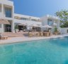 Dining spaces flow across several rooms centred on the sleek bar and spill out onto the poolside terrace.