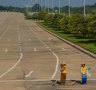 The only signs of life in Naypyidaw are the straw-hatted street sweepers.