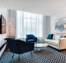 The Inchcolm by Ovolo's City View Loft Suite's art deco-style oft furnishings and colours flow well.