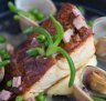 Freshly caught fish with surf clams, bacon and peas.