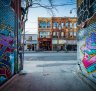 Street art in Graffiti Alley and buildings on Queen Street West, in the Fashion District of Toronto. 