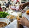 Tasting banh mi in Hanoi old town.