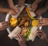 Injera is typically served communally, one large pancake with wots for a group of people who all eat with their hands.