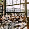 The steel and glass atrium features a retractable roof for warmer days.