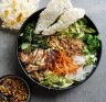 Charred lemongrass chicken spring roll bowls with chunky peanut hoisin dressing. 