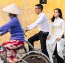 Locals on bicycles in the historic centre of Hoi An, Vietnam.