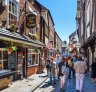 Pubs, shops and cafes on the historic Shambles, York, North Yorkshire, England.