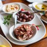 Marinated olives and octopus as part of a Greek feast at Mythos in Oakleigh.