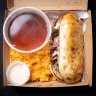 Cheesesteak with consomme and a side of rice.