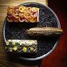 Pan tomate (left) and anchovy churro.