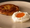 Malawach, a flaky Yemenite pastry, with house-made buttermilk ricotta and trout roe. 