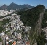 RIO DE JANEIRO, BRAZIL - JULY 04:  Hillside 'favela' communities stand in the foreground on July 4, 2016 in Rio de Janeiro, Brazil. July 5 marks the one-month mark to the beginning of the Rio 2016 Olympic Games with an economic crisis, political turmoil and Zika virus fears roiling the country.  (Photo by Mario Tama/Getty Images) Rio favelas