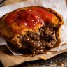 The perfect Aussie meat pie served with sauce, of course.